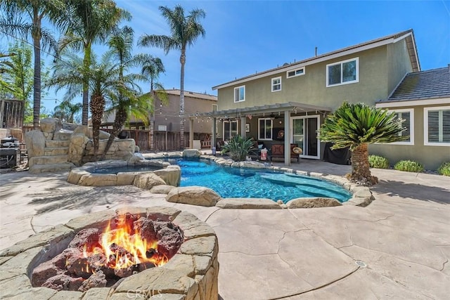 view of swimming pool with a fenced in pool, fence, a patio area, an in ground hot tub, and a pergola