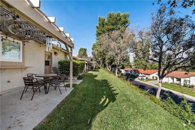 view of yard featuring a patio area and a pergola