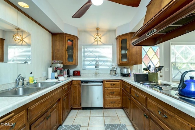 kitchen with under cabinet range hood, dishwasher, brown cabinets, electric stovetop, and a sink