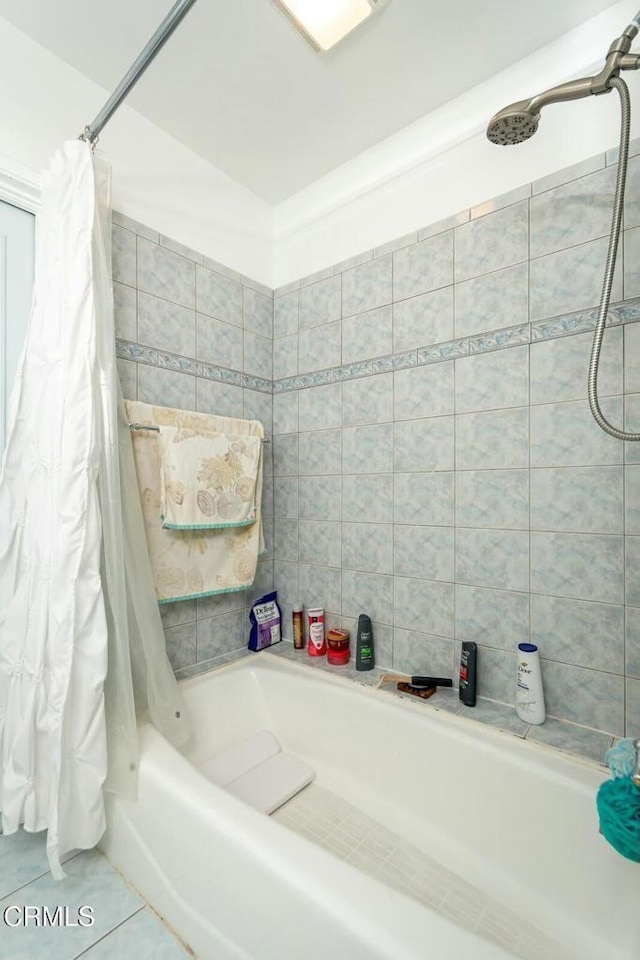 full bathroom with tile patterned floors and shower / tub combo