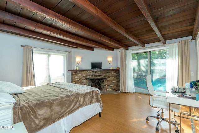 bedroom with wood finished floors, access to outside, wood ceiling, and beam ceiling