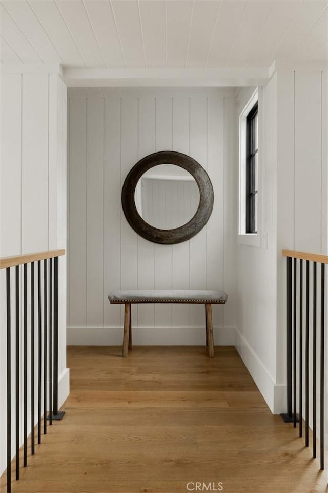 interior space featuring baseboards and light wood-style floors