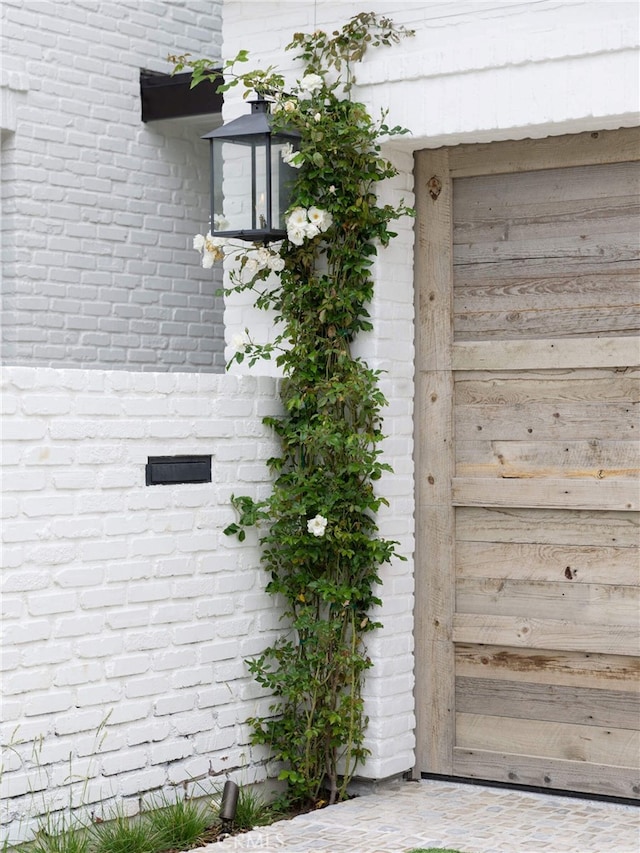 exterior details featuring brick siding