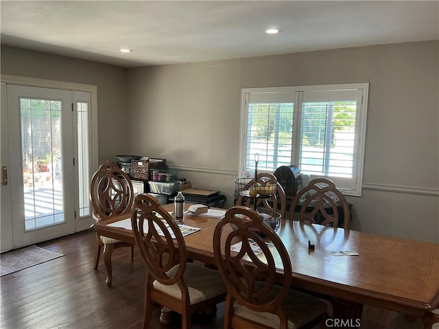 dining area with recessed lighting and wood finished floors
