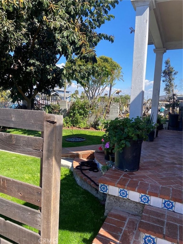 view of yard featuring a patio area and fence