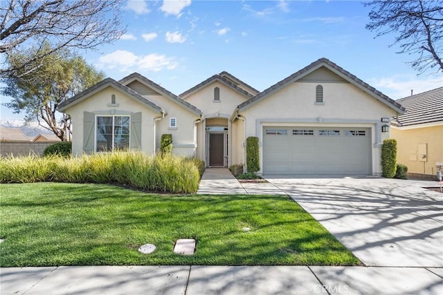 view of front facade featuring stucco siding, a front lawn, concrete driveway, and a garage