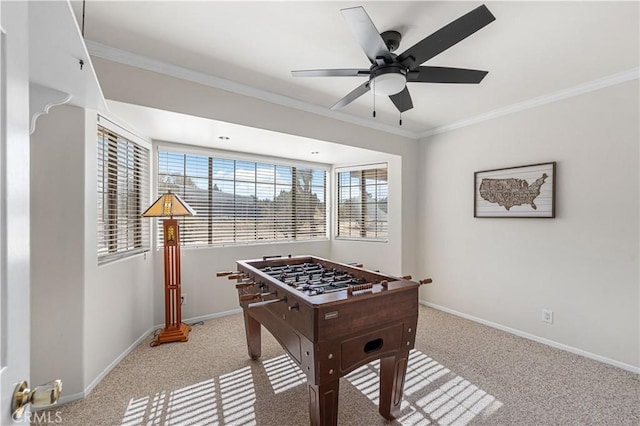 recreation room featuring baseboards, carpet, and ornamental molding