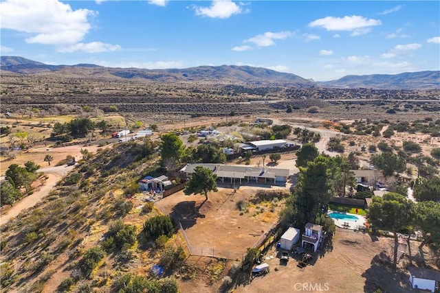 drone / aerial view featuring a mountain view