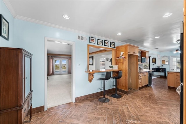 kitchen featuring visible vents, crown molding, baseboards, wine cooler, and recessed lighting