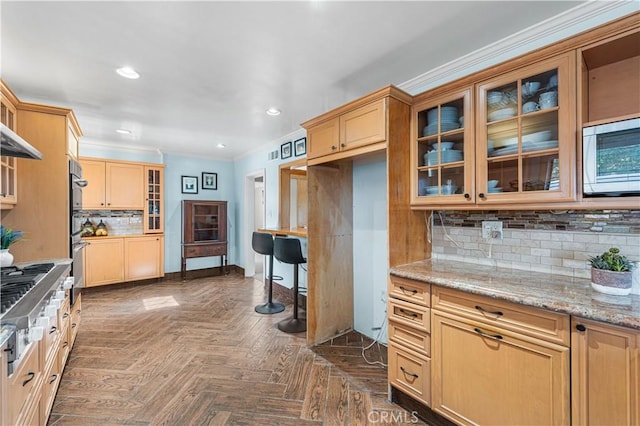 kitchen featuring crown molding, recessed lighting, glass insert cabinets, and stainless steel appliances