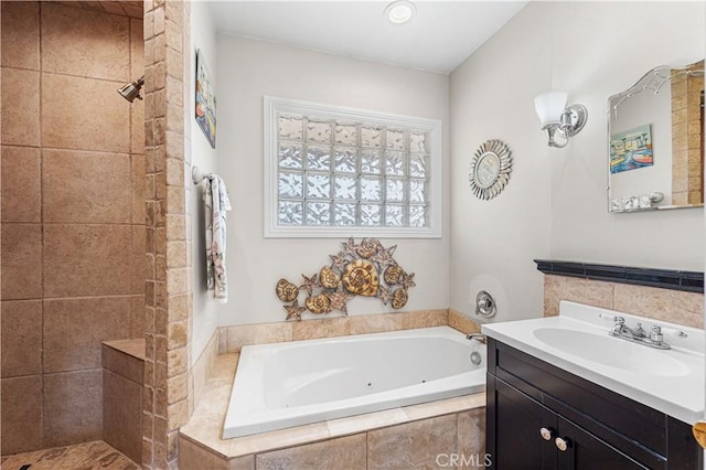 full bath featuring a tub with jets, tiled shower, and vanity