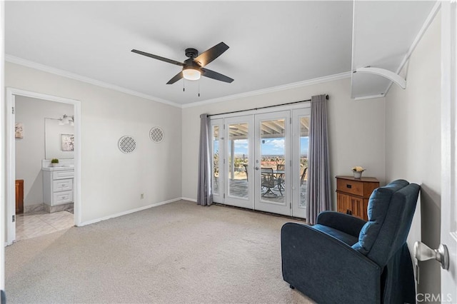 living area with crown molding, french doors, baseboards, and carpet floors