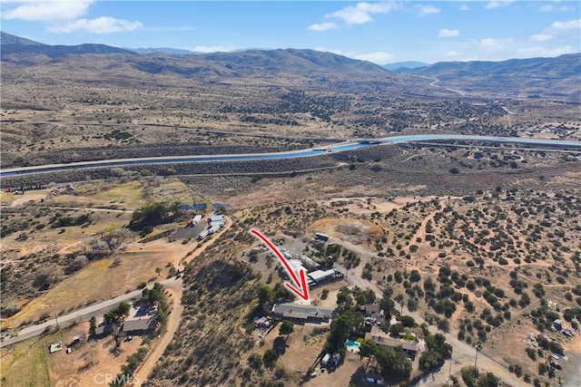 drone / aerial view featuring a mountain view