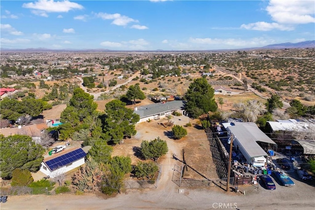 birds eye view of property featuring a mountain view