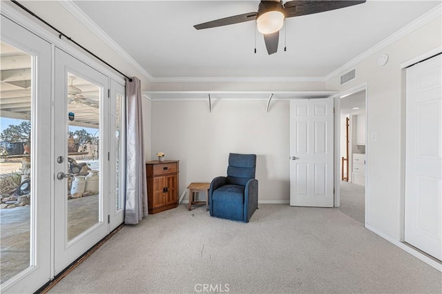 sitting room featuring visible vents, crown molding, baseboards, carpet floors, and french doors