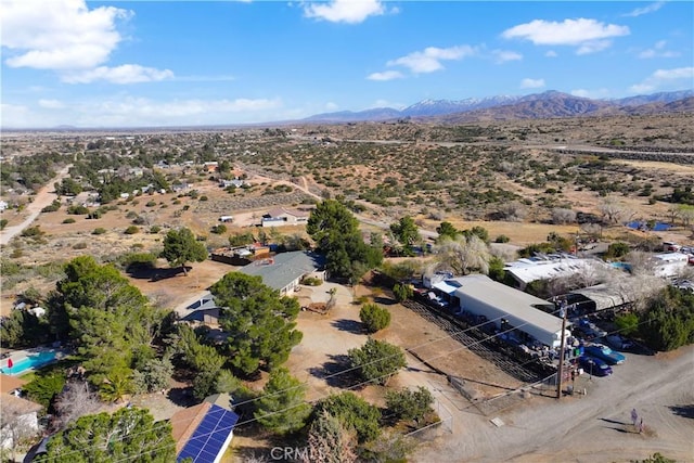 birds eye view of property featuring a mountain view