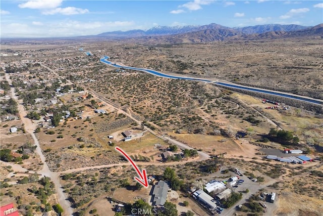 drone / aerial view featuring view of desert and a mountain view