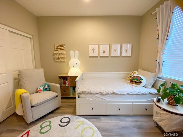 bedroom featuring wood finished floors