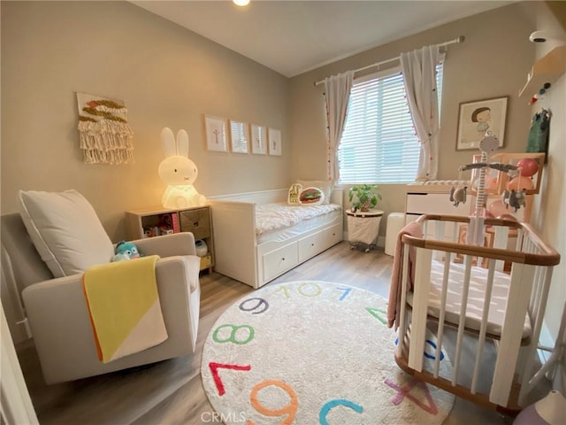 bedroom featuring wood finished floors