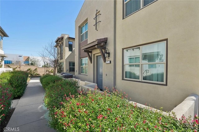 view of side of property featuring stucco siding