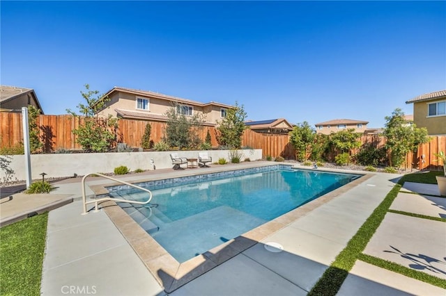 view of pool with a patio, a fenced backyard, and a fenced in pool