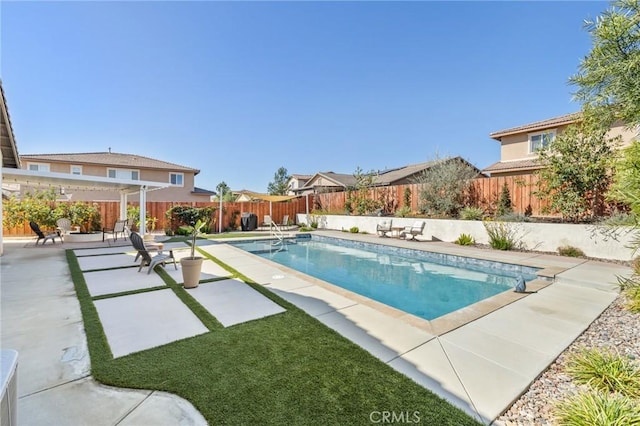 view of pool with a fenced in pool, a patio, and a fenced backyard