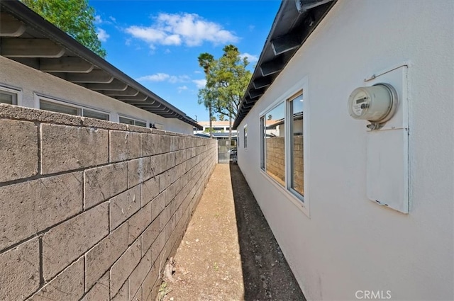 view of home's exterior with fence