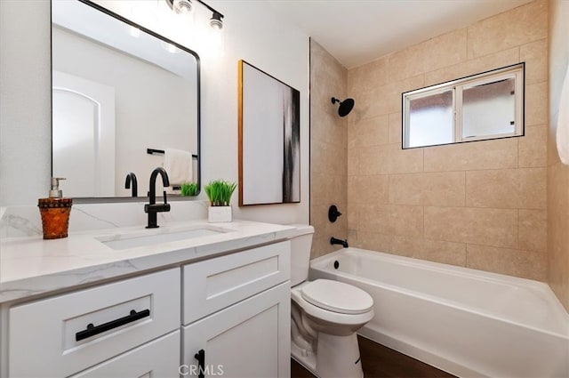 bathroom with shower / washtub combination, toilet, and vanity