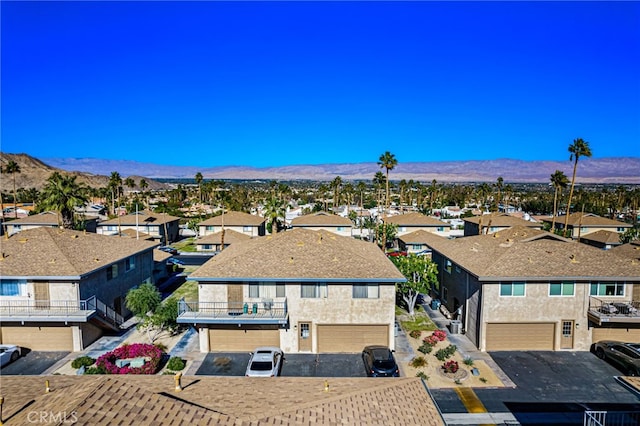 aerial view featuring a mountain view and a residential view