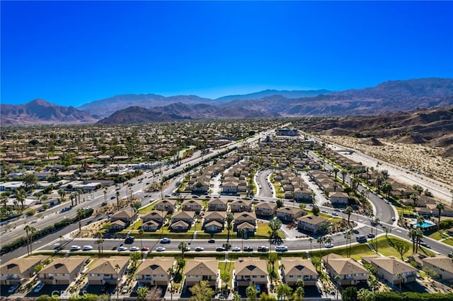 birds eye view of property with a mountain view and a residential view