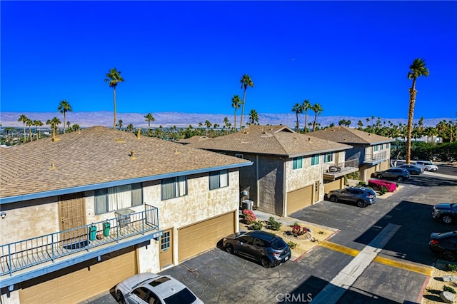 exterior space with a mountain view and a residential view