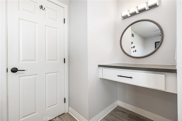 bathroom featuring baseboards and wood finished floors