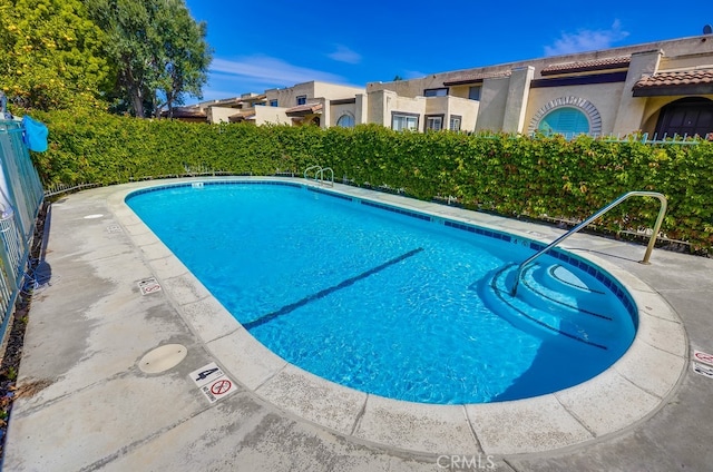 community pool with fence