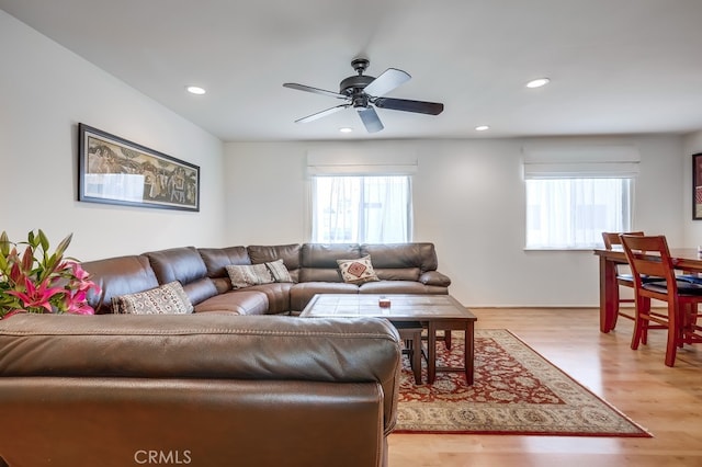 living room featuring recessed lighting, a healthy amount of sunlight, light wood finished floors, and ceiling fan