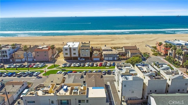 aerial view featuring a beach view, a residential view, and a water view