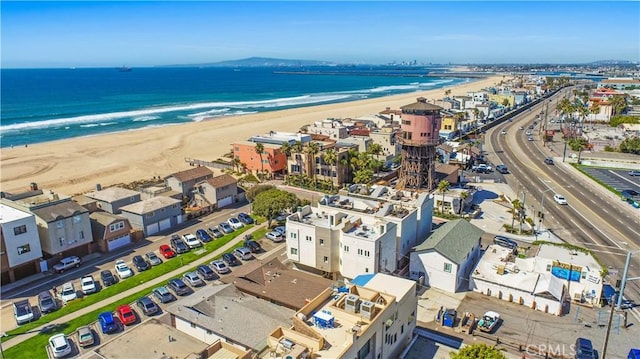 bird's eye view with a view of the beach and a water view