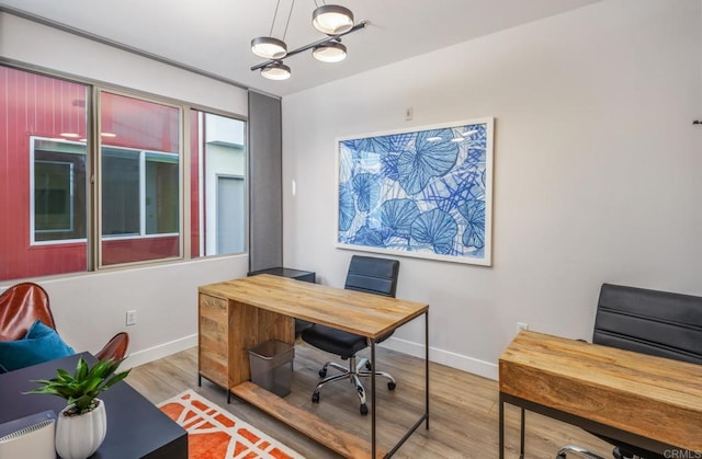 office with wood finished floors and baseboards