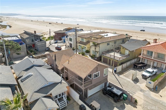 aerial view with a view of the beach, a residential view, and a water view