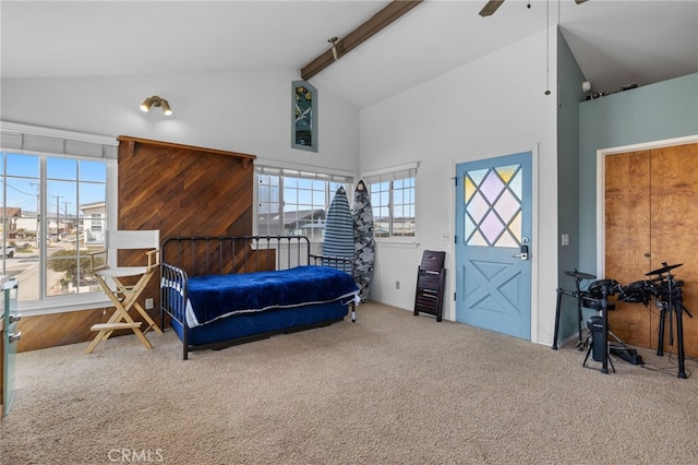 bedroom with beamed ceiling, carpet floors, high vaulted ceiling, and a ceiling fan