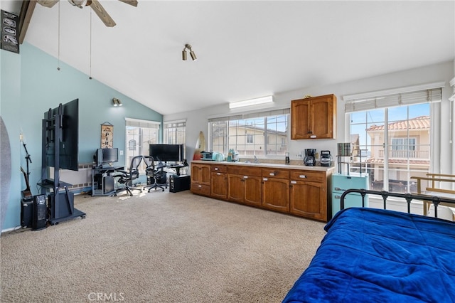 bedroom with light carpet, high vaulted ceiling, and ceiling fan