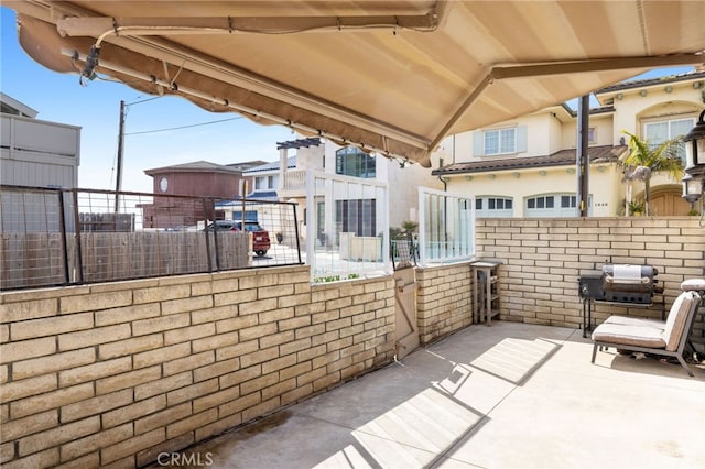 view of patio / terrace with fence