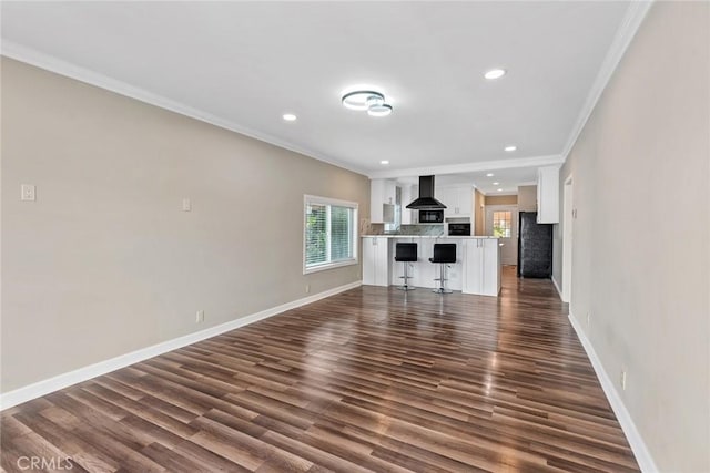 unfurnished living room featuring recessed lighting, crown molding, baseboards, and dark wood-style flooring