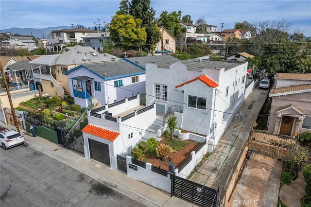 birds eye view of property with a residential view