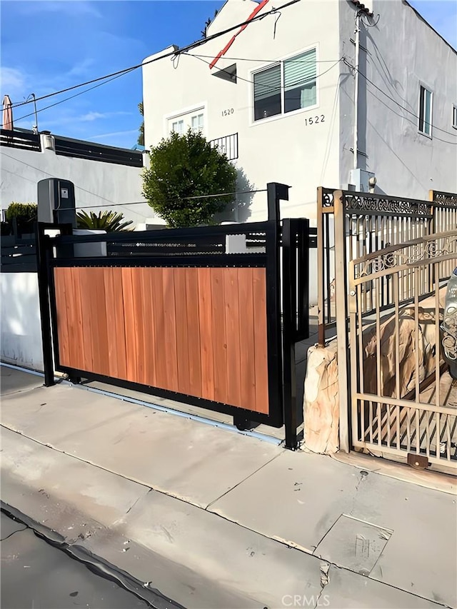 view of gate featuring a fenced front yard