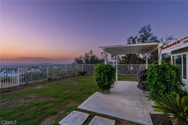 view of yard with a fenced backyard, a pergola, and a patio area