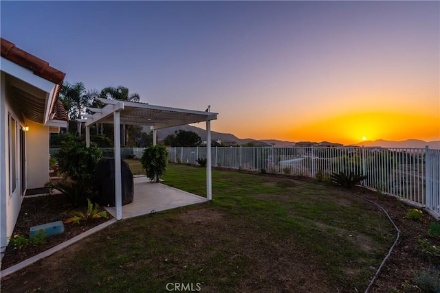 view of yard featuring a patio, fence, and a pergola