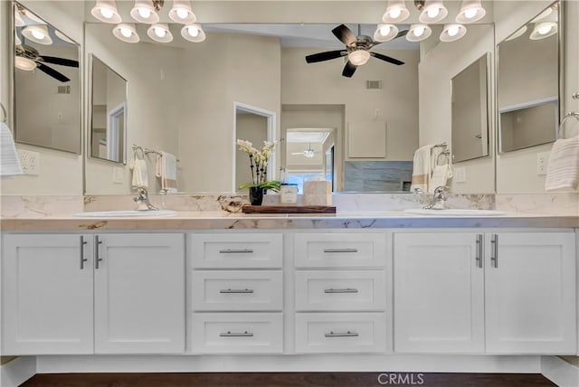 full bath with a sink, visible vents, and ceiling fan