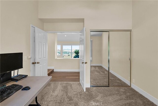 carpeted office with baseboards