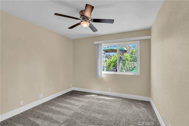 unfurnished room with baseboards, carpet, and a ceiling fan