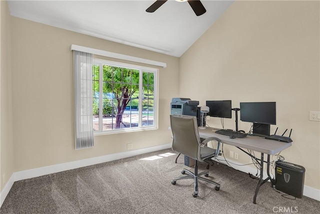 office area featuring lofted ceiling, carpet, baseboards, and ceiling fan